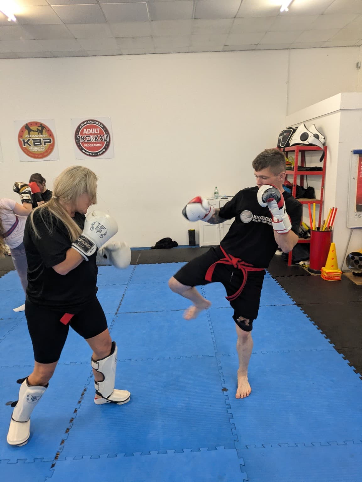 Adults building confidence and movement through coached practice at John McKean Academy